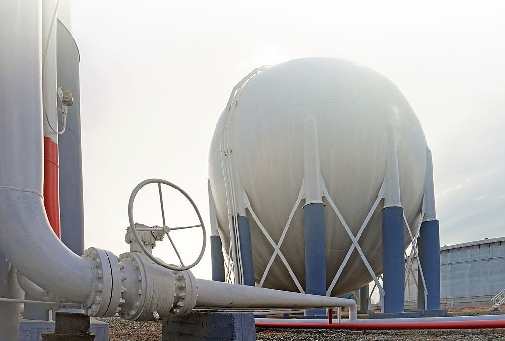 Spherical industrial storage tank with associated pipework and isolation valve